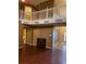 Two-story living room with hardwood floors and balcony at 3668 Deer Springs Pkwy, Ellenwood, GA 30294