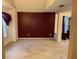Spacious living room with burgundy walls and carpet at 3668 Deer Springs Pkwy, Ellenwood, GA 30294
