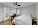 Bedroom with wood floors, ceiling fan and en-suite bathroom at 244 Mirandy Way, Lawrenceville, GA 30044