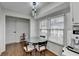 Bright breakfast nook with glass table and built in coffee station at 244 Mirandy Way, Lawrenceville, GA 30044