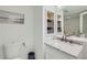 Modern bathroom with marble vanity, updated fixtures, and built-in shelving at 2870 Pharr Court S Nw # 2703, Atlanta, GA 30305