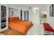 Studio apartment bedroom with orange bedding and built-in shelving at 2870 Pharr Court S Nw # 2703, Atlanta, GA 30305