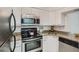 Modern kitchen with stainless steel appliances and granite countertops at 2870 Pharr Court S Nw # 2703, Atlanta, GA 30305
