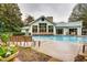 Community pool with adjacent lounge chairs and building at 2870 Pharr Court S Nw # 2703, Atlanta, GA 30305