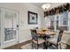 Kitchen breakfast nook with table and chairs, offering access to a patio at 3610 High Battery Nw Blf, Acworth, GA 30101