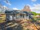 Gray house with a white porch and a spacious yard at 51 Jennifer Ln, Rydal, GA 30171
