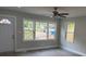 Spacious living room with ceiling fan and large windows at 316 Henry Aaron Sw Ave, Atlanta, GA 30310