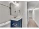 Updated bathroom features a blue vanity, white countertop, and a large mirror at 356 Lake Dr, Atlanta, GA 30354