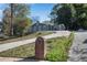 Gray house with a long driveway and landscaping at 356 Lake Dr, Atlanta, GA 30354