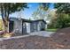 Rear exterior view of gray house with backyard and patio at 356 Lake Dr, Atlanta, GA 30354