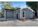 Gray house with a dark door and small landscaping at 356 Lake Dr, Atlanta, GA 30354