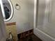 Bathroom with shower/tub combo and some exposed wall and floor areas at 915 Lake Dr, Snellville, GA 30039