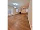 Spacious living room featuring hardwood floors, a fireplace, and an accent wall at 60 Ella Dr, Covington, GA 30016