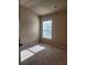 Bright bedroom with large window and carpet flooring at 1212 Lake Point Way, Suwanee, GA 30024