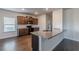 Kitchen with dark wood cabinets, granite countertops, and black appliances at 3480 Ridge Hill Pkwy, Douglasville, GA 30135