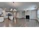 Open concept kitchen and living area with hardwood floors and island at 611 Mason Grove Pkwy, Lawrenceville, GA 30043