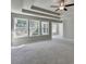 Bright main bedroom featuring a tray ceiling, multiple windows and ample space at 611 Mason Grove Pkwy, Lawrenceville, GA 30043