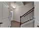 Elegant staircase with wrought-iron railing and hardwood floors at 611 Mason Grove Pkwy, Lawrenceville, GA 30043