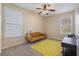 Cozy bedroom with a yellow rug and window seating at 645 Wexford Ct, Acworth, GA 30102