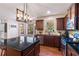 Island kitchen with granite countertops and stainless steel appliances at 645 Wexford Ct, Acworth, GA 30102