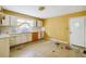 Kitchen with white cabinets and vinyl flooring at 1238 Greenwich St, Atlanta, GA 30310