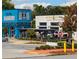 Two adjacent local businesses, one blue and one white, with outdoor seating at 310 Mcdonough Se Blvd # 103, Atlanta, GA 30315