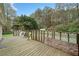 Wooden deck overlooking backyard with wooded area at 1874 Old Lost Mountain Rd, Powder Springs, GA 30127