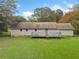 Ranch style home with backyard and deck at 1874 Old Lost Mountain Rd, Powder Springs, GA 30127