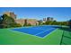 Blue tennis court with green perimeter at 2870 Pharr Court South Nw # 2602, Atlanta, GA 30305
