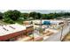 Aerial view of a vibrant mixed-use development with various shops and ample parking at 392 Pratt Se Dr # 2023, Atlanta, GA 30315