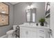 Bathroom with single vanity, toilet, and decorative wall art at 392 Pratt Se Dr # 2023, Atlanta, GA 30315