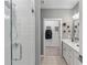 Modern bathroom with double vanity, walk-in shower, and patterned tile floor at 392 Pratt Se Dr # 2023, Atlanta, GA 30315