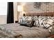 Close up of Primary bed with leather headboard and patterned bedding at 392 Pratt Se Dr # 2023, Atlanta, GA 30315