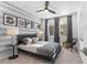 Bright bedroom with a striped accent wall and large windows at 392 Pratt Se Dr # 2023, Atlanta, GA 30315