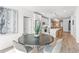 Modern dining area with a round table and chairs, open to the kitchen at 392 Pratt Se Dr # 2023, Atlanta, GA 30315