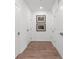 Bright hallway with wood flooring and minimal wall decor at 392 Pratt Se Dr # 2023, Atlanta, GA 30315