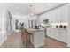 Modern kitchen with white cabinets, large island, and gold accents at 392 Pratt Se Dr # 2023, Atlanta, GA 30315