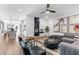 Open concept living room with kitchen views, modern furniture, and hardwood floors at 392 Pratt Se Dr # 2023, Atlanta, GA 30315