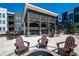Outdoor kitchen and patio area with seating and fire pit at 392 Pratt Se Dr # 2023, Atlanta, GA 30315