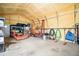 Insulated garage interior, featuring shelving, and space for equipment at 1715 Sawnee Meadow Ln, Cumming, GA 30040