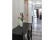 Bright hallway with black accent table and flowers at 1280 W Peachtree Nw St # 914, Atlanta, GA 30309