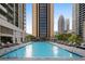 Inviting rooftop pool with ample lounge chairs and city views at 1280 W Peachtree Nw St # 914, Atlanta, GA 30309