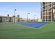 Well-maintained outdoor tennis court with green surrounding at 1280 W Peachtree Nw St # 914, Atlanta, GA 30309