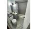Updated bathroom with gray tile, patterned floor, and bathtub at 215 Piedmont Ne Ave # 1905, Atlanta, GA 30308