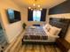 King bedroom with large TV and stylish decor at 215 Piedmont Ne Ave # 1905, Atlanta, GA 30308