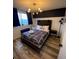 Spacious bedroom with a king-size bed and modern decor at 215 Piedmont Ne Ave # 1905, Atlanta, GA 30308