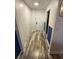 Bright entryway with wood-look flooring and blue accent walls at 215 Piedmont Ne Ave # 1905, Atlanta, GA 30308