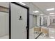 Building hallway with mirrored walls, modern chairs, and apartment number 1905 at 215 Piedmont Ne Ave # 1905, Atlanta, GA 30308