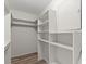 Spacious walk-in closet with built-in shelves at 1433 Mary Dale Dr, Lilburn, GA 30047