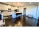 Modern kitchen with white cabinets, center island, and stainless steel appliances at 7860 Bristol Valley Dr, Cumming, GA 30028